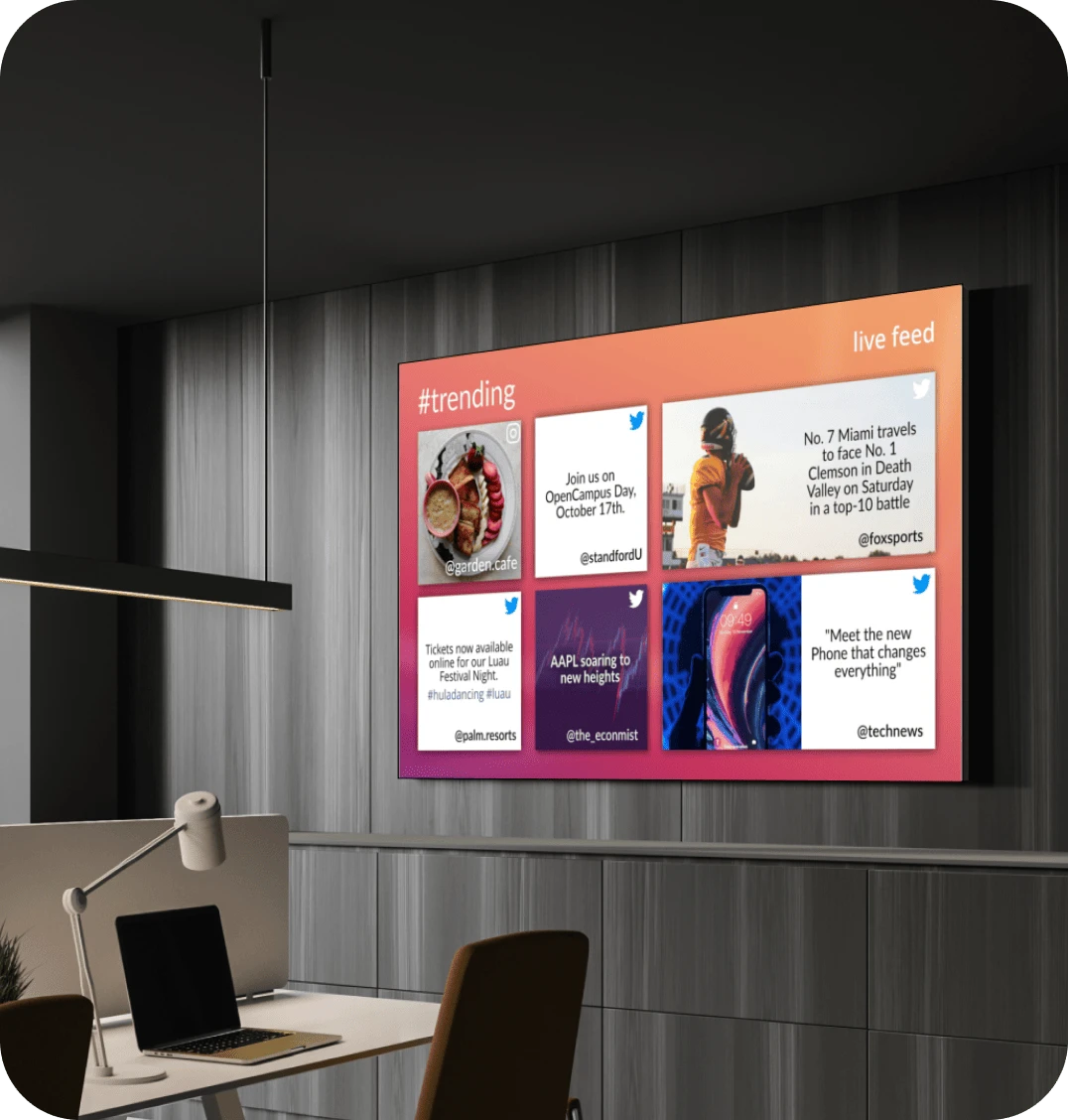 A corporate digital signage screen displays the company's social media wall.