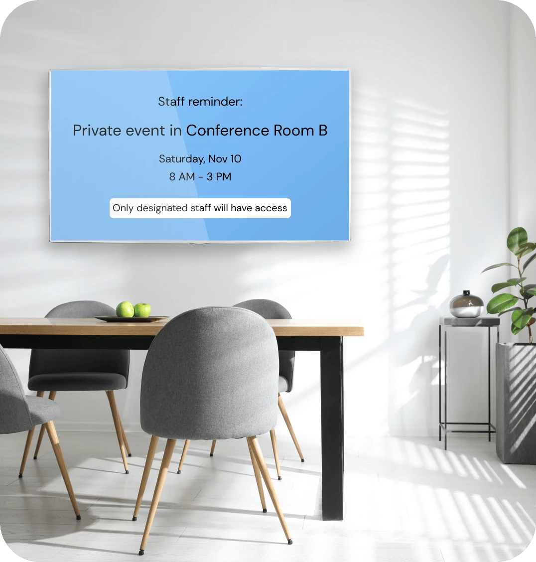 A digital signage screen in hotel employee break room displays a reminder about an upcoming hotel event