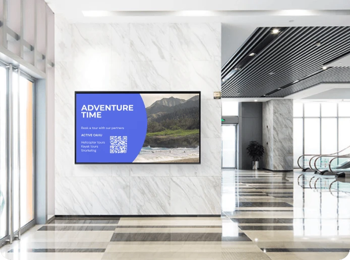 A digital signage screen in a hotel displays a promotion about tourist services