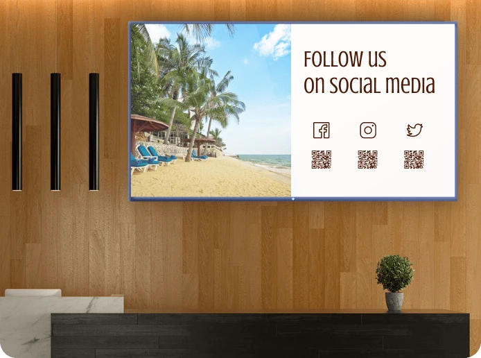 A hotel reception digital signage screen displays a promotional slide for their social media accounts